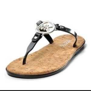 Michael Kors flip flops. Gold accents.