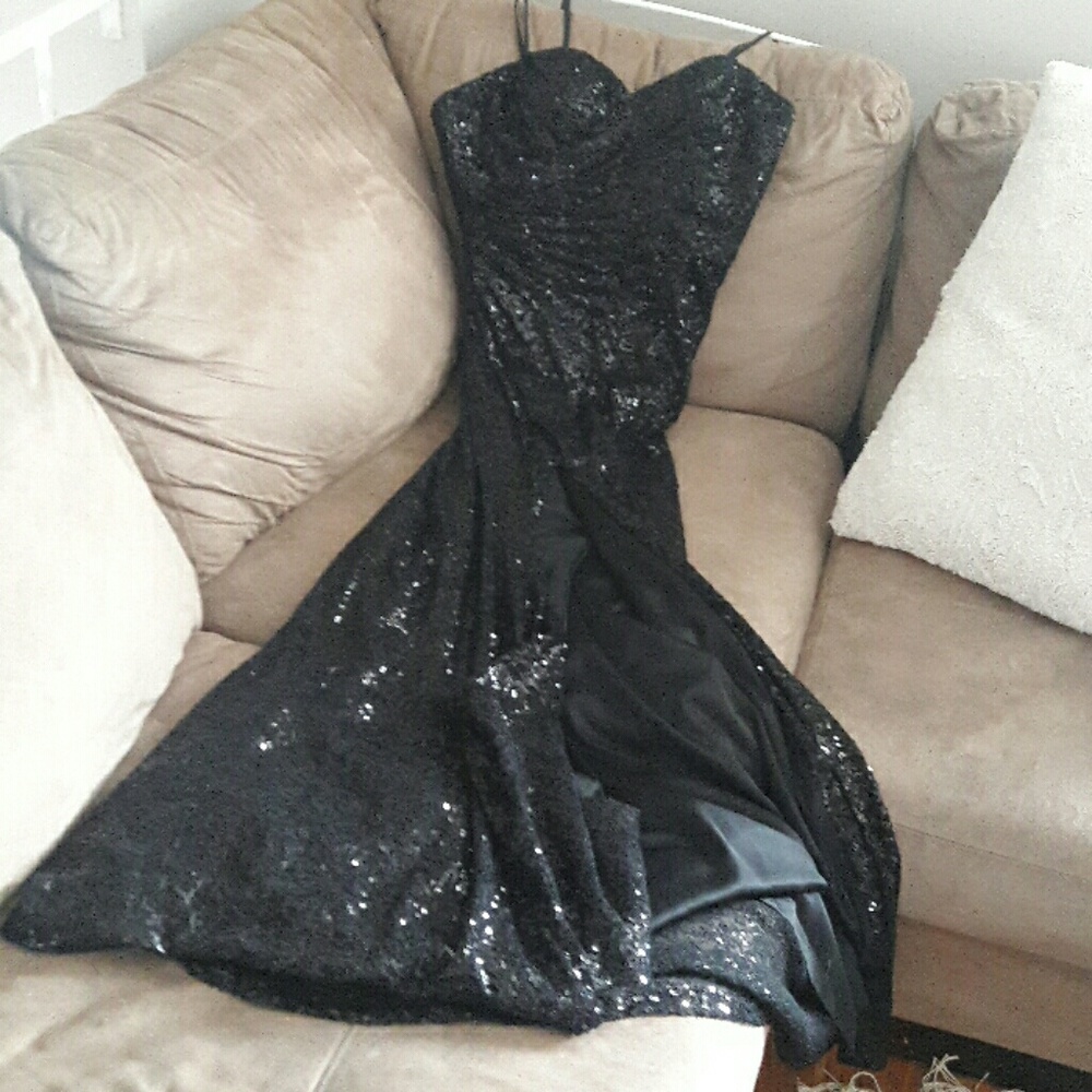 Black sequin strapless gown with a slit