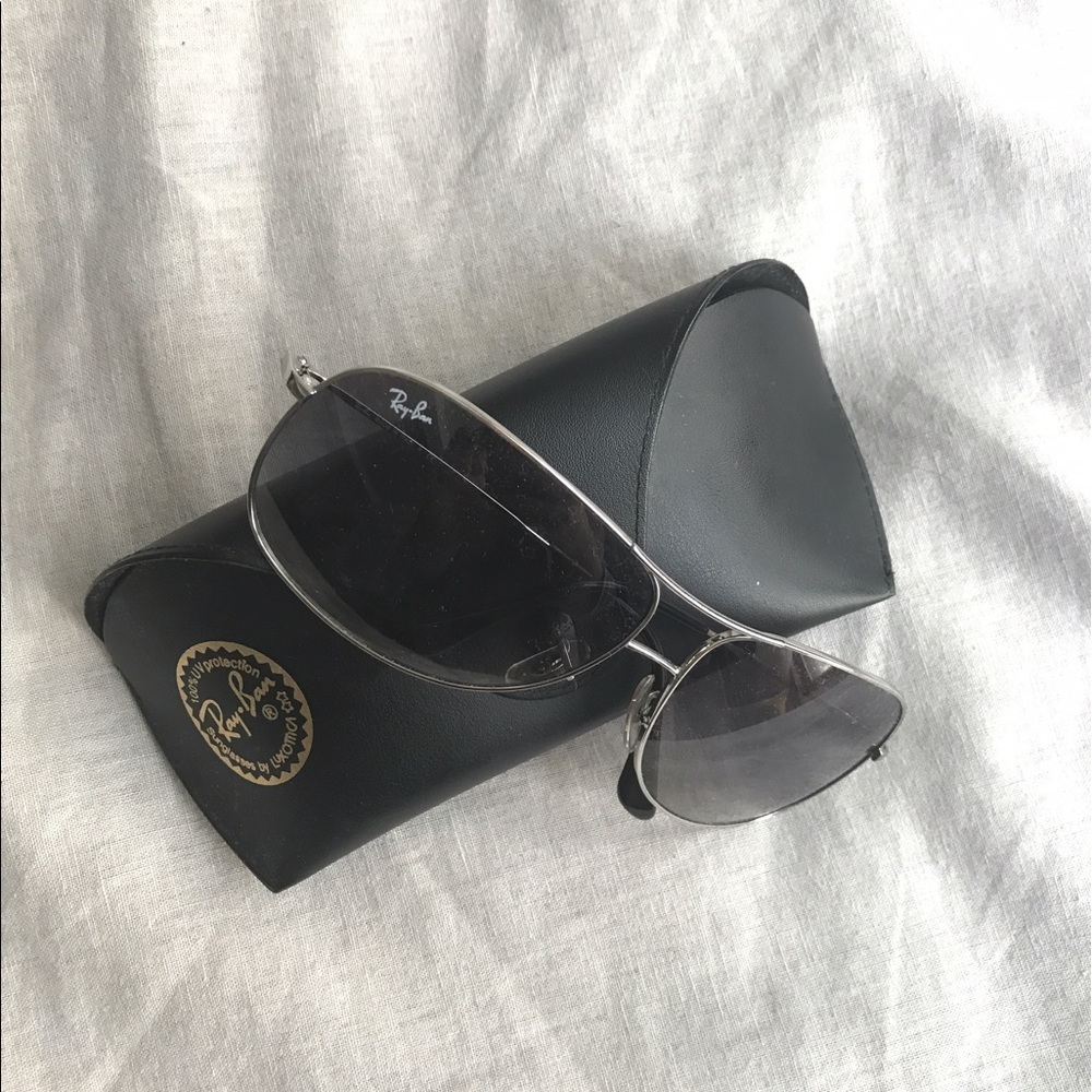Brand new Ray-Bans with leather case.