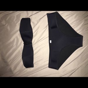 Black neoprene strapless bathing suit