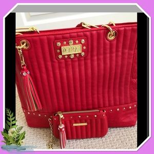 Pre-own Betsey Johnson Tote and wallet set.