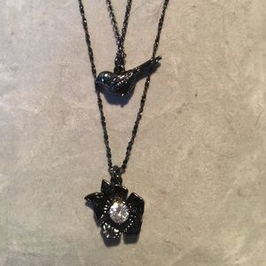 Juicy Couture bird and flower necklace set