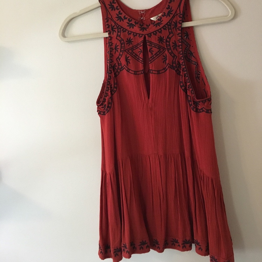 Orange high neck peplum.