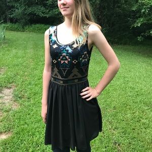 Sequined black mini dress for a formal occasion