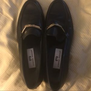 Black flats with gold buckle detail