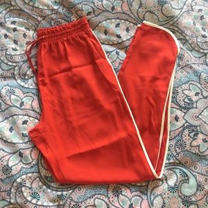 Silk feel red pants with white piping