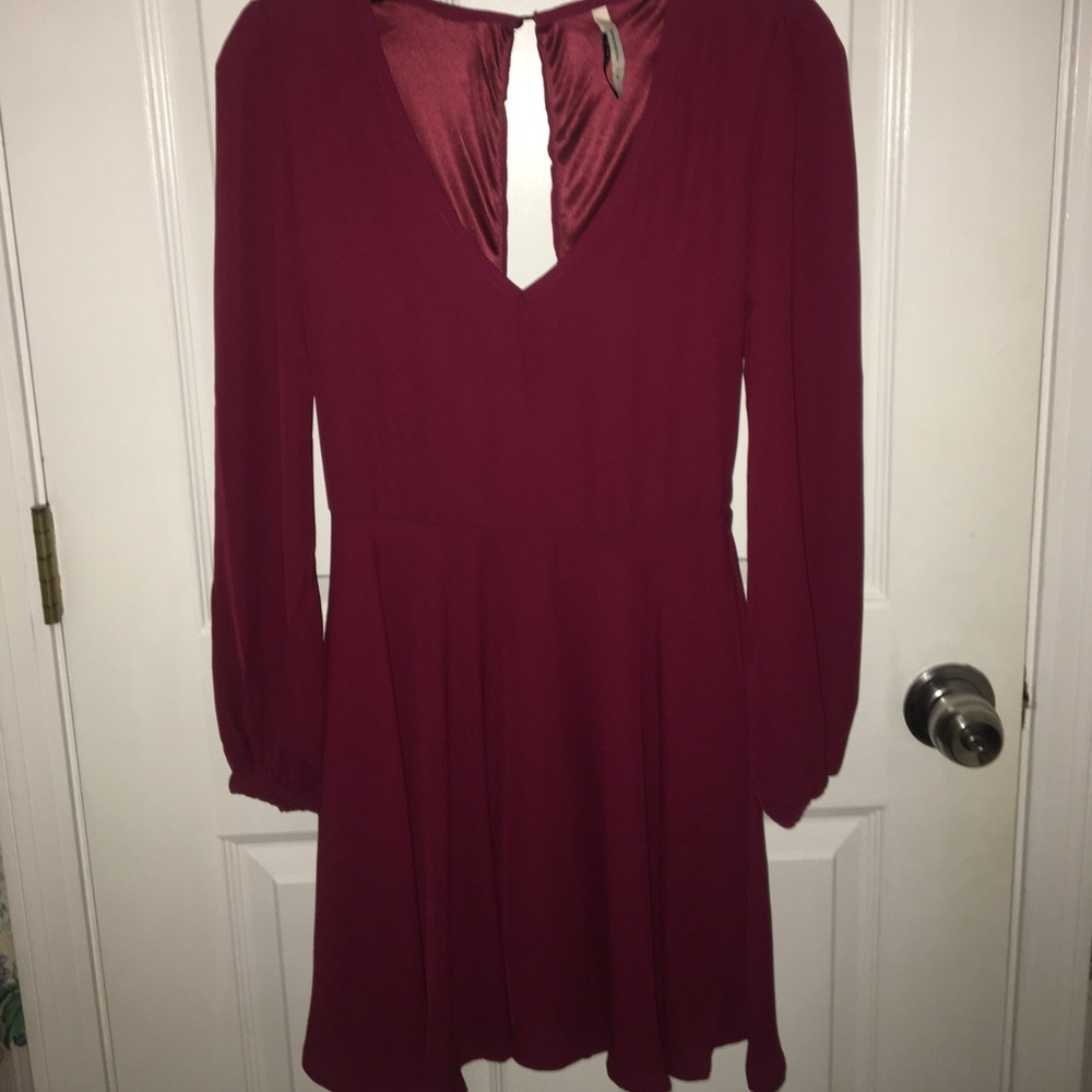 She inside burgundy long sleeved dress