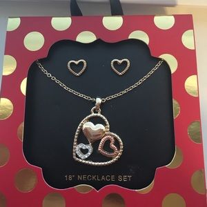 Gold heart-shaped necklace with matching earrings