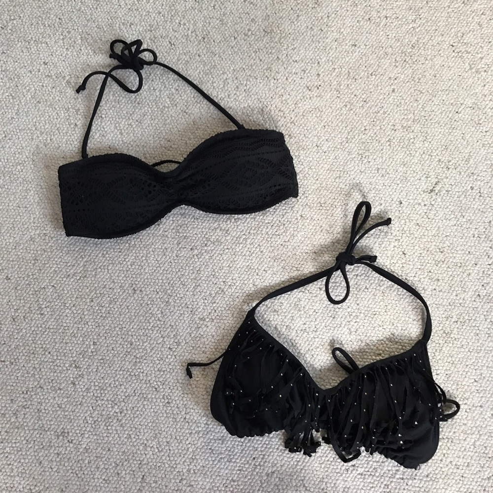 Two black bathing suit tops
