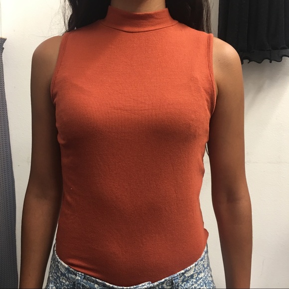 orange sleeveless turtleneck