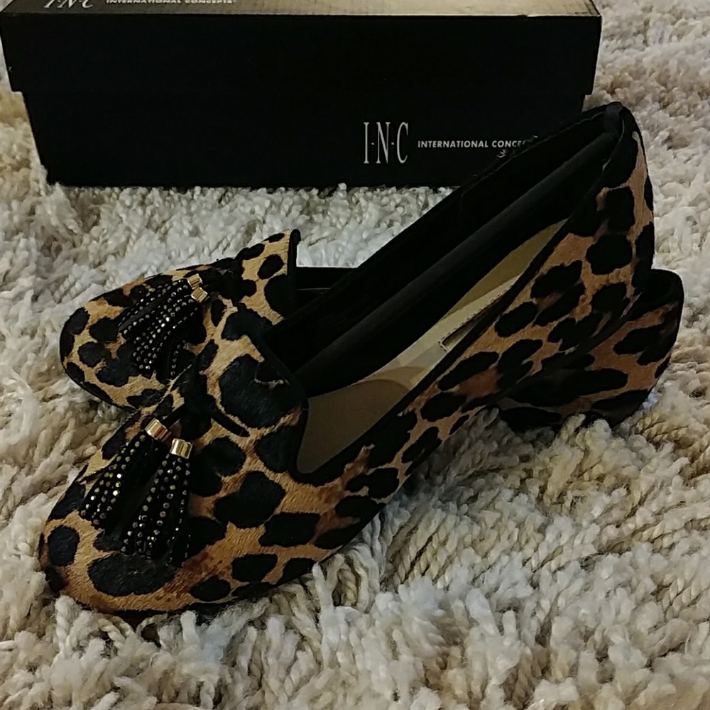 Leopard flats with black and gold tassels