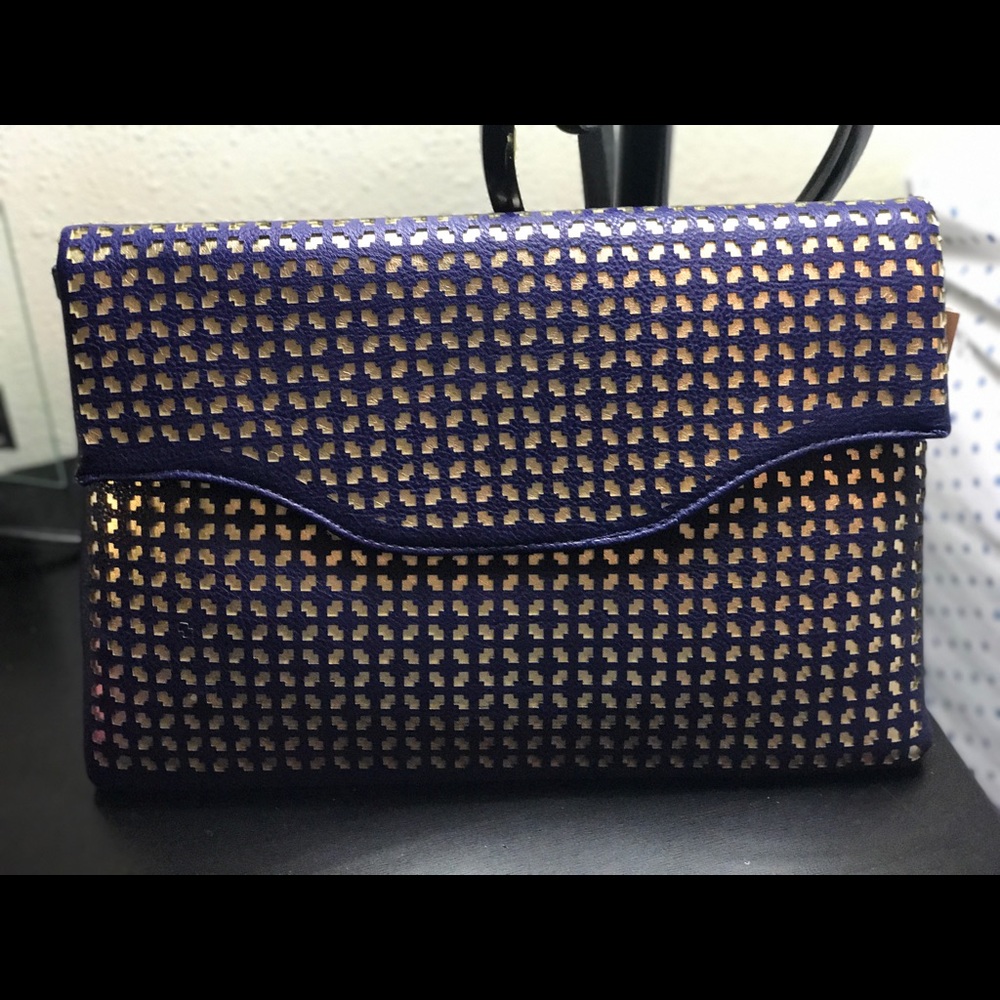 Navy blue and gold perforated clutch