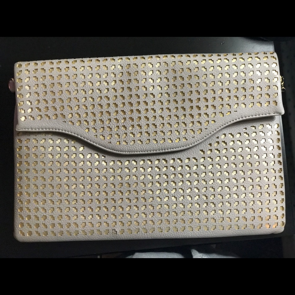 Grey and gold perforated clutch