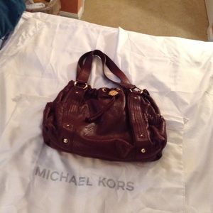 Authentic Michael Kors purse. Pockets on each end.
