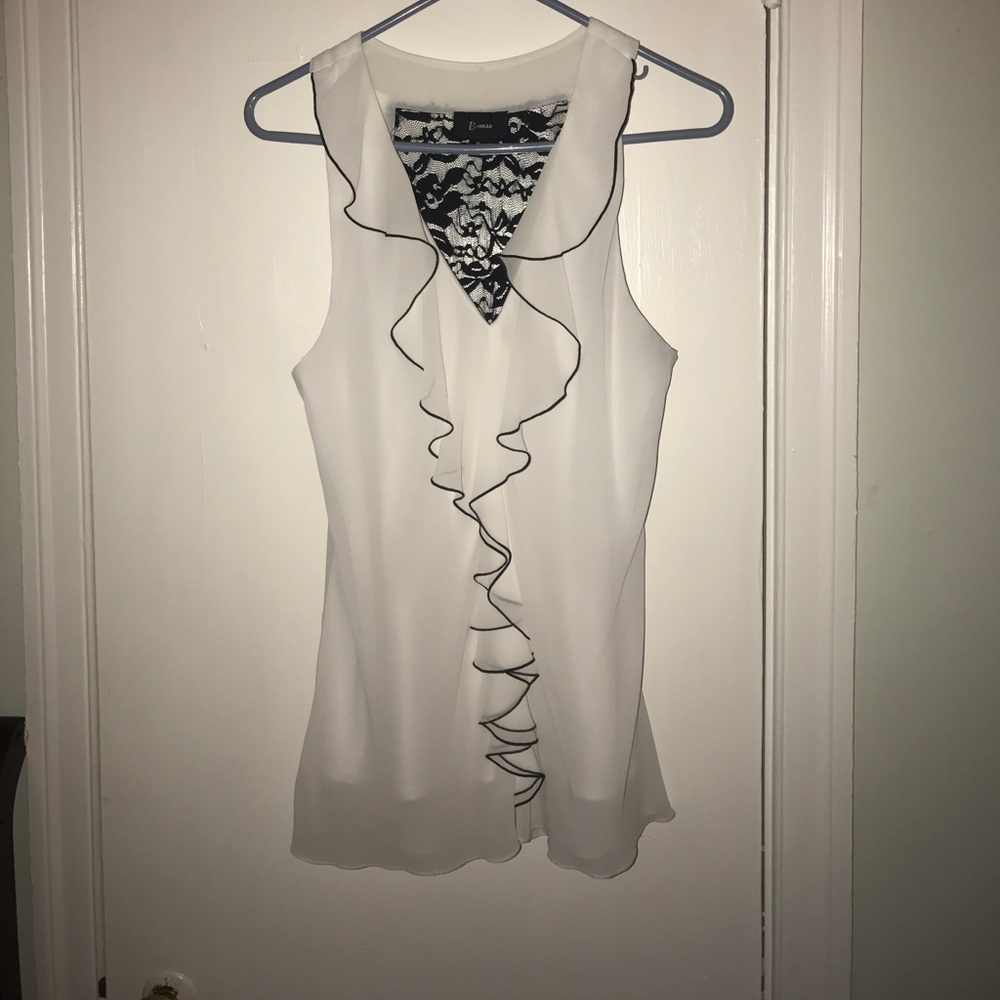 Sleeveless black and white blouse