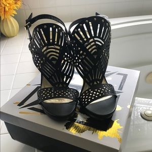 Black Wedge Heels size 7. Never worn Original box.