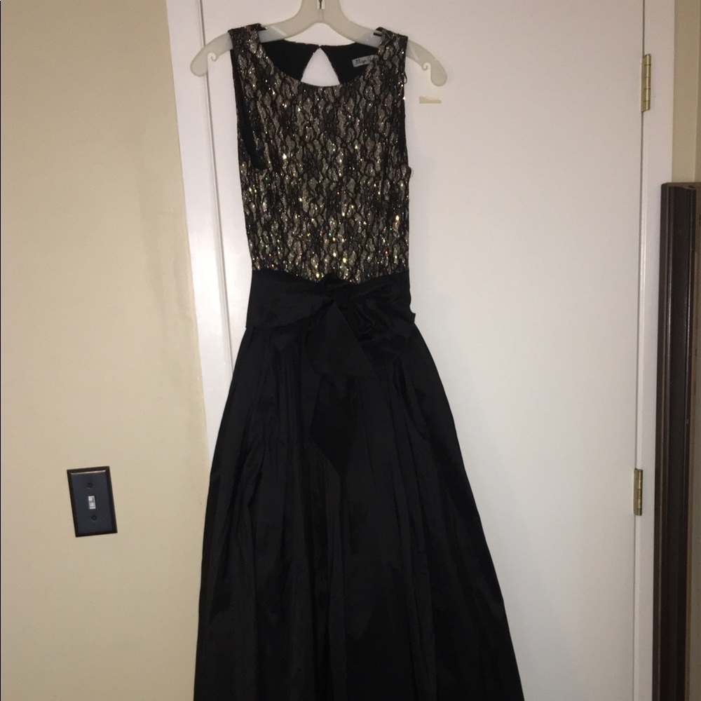 Black and gold floor length ball gown by Eliza J