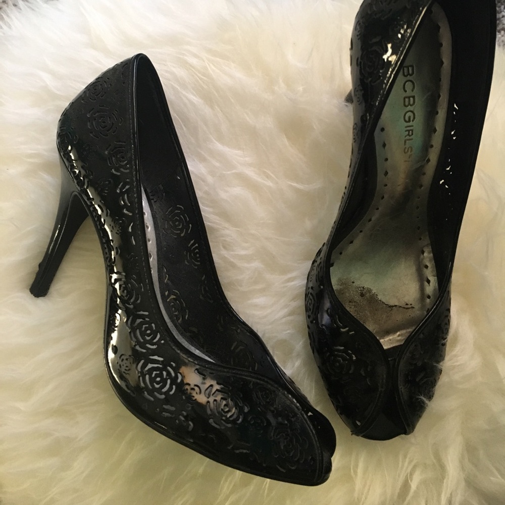 BCBGirls black heels with laser cutouts.