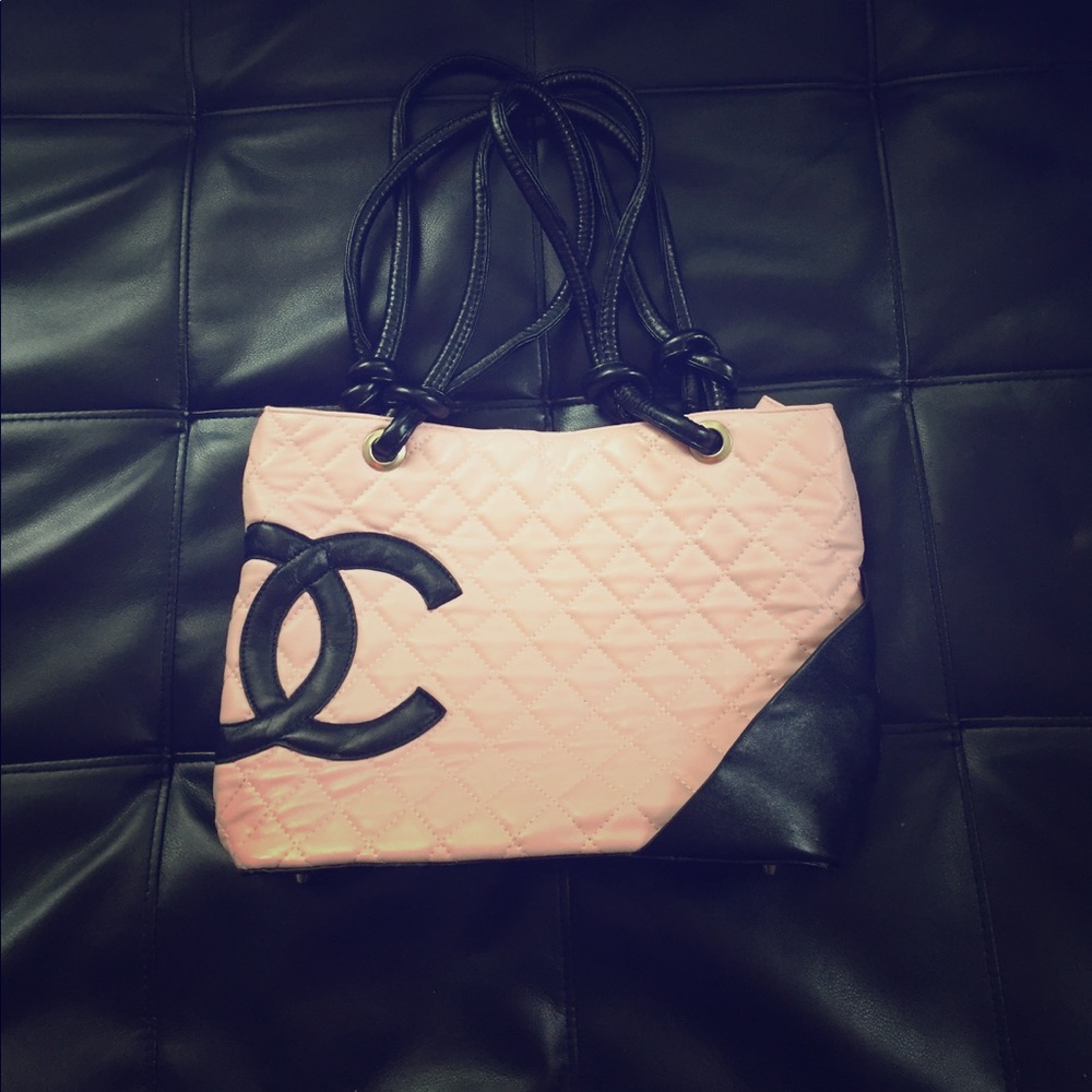 This is a Chanel pink and black purse.