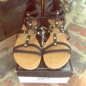 Black sandles with gold accents flats