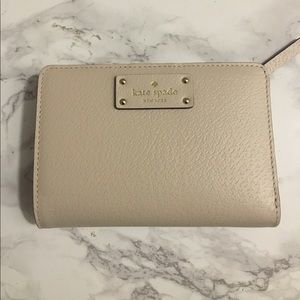 Nude snap front kate spade wallet