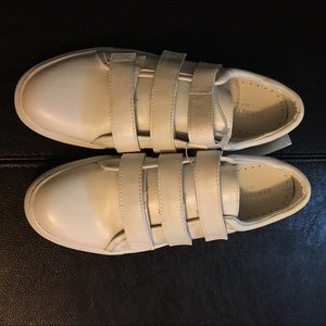 All white Kenneth Cole sneakers