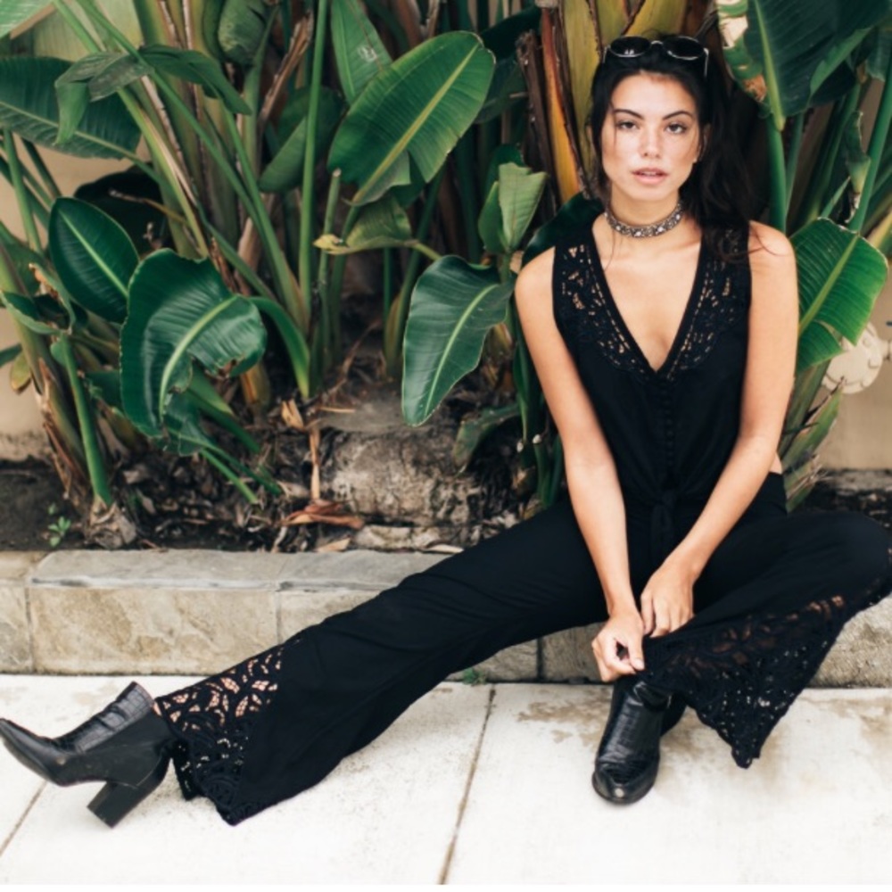 Black flare pants with embroidery. Hawaii designer