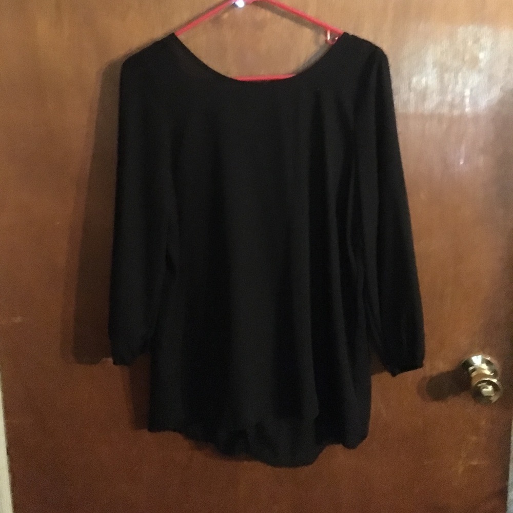 Black blouse with silver sequin bow on the back!