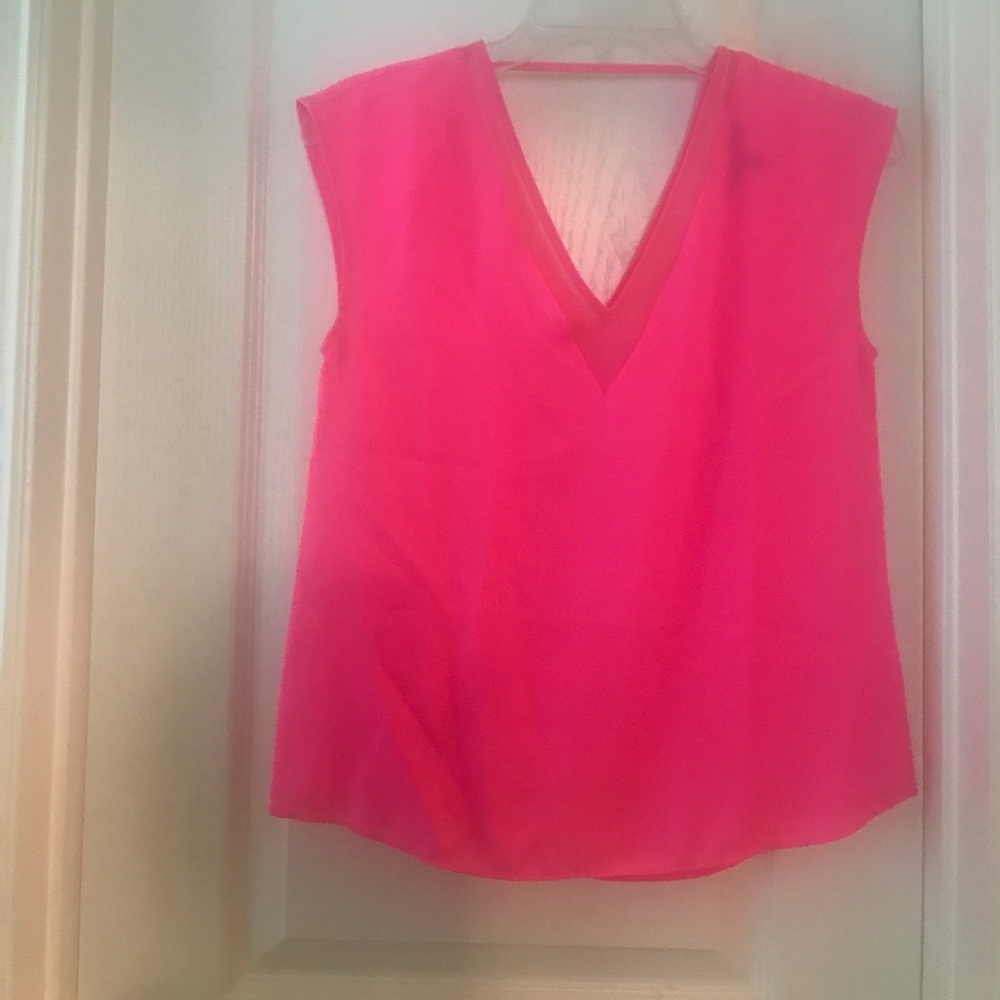 Neon pink EXPRESS shirt.