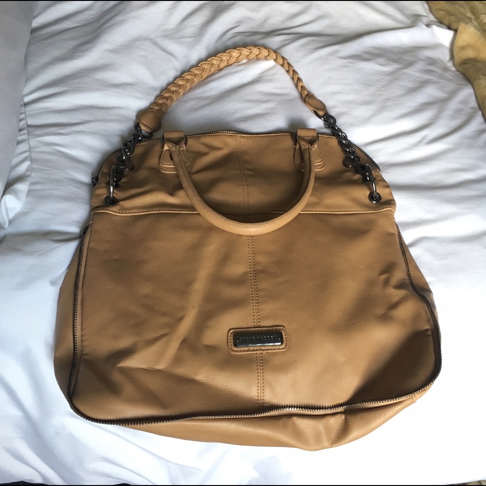 Convertible Steve Madden fold-over bag.