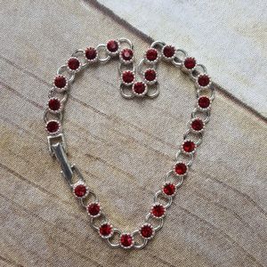 Silvertone and ruby rhinestone Avon bracelet