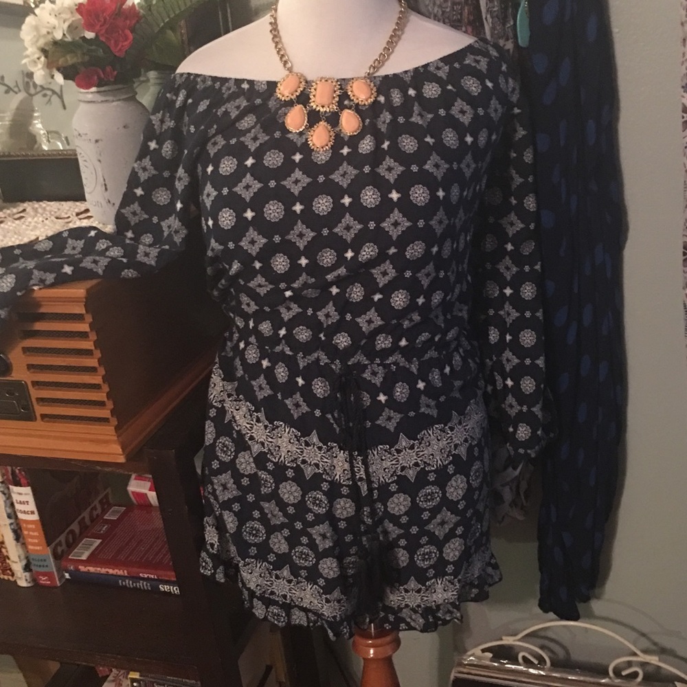 Adorable off the shoulder romper.