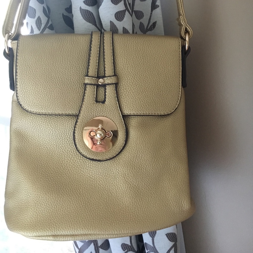 Beautiful gold cross body purse. NWOT, never used.