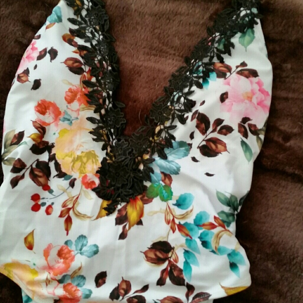 One piece flower bathing suit with black lace trim