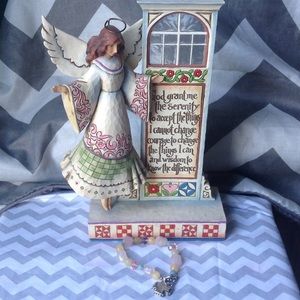 Angle prayer with bracelet.