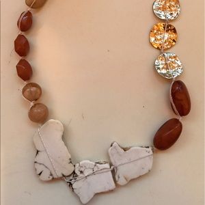 Multiple shades of brown & 3 gold colored discs