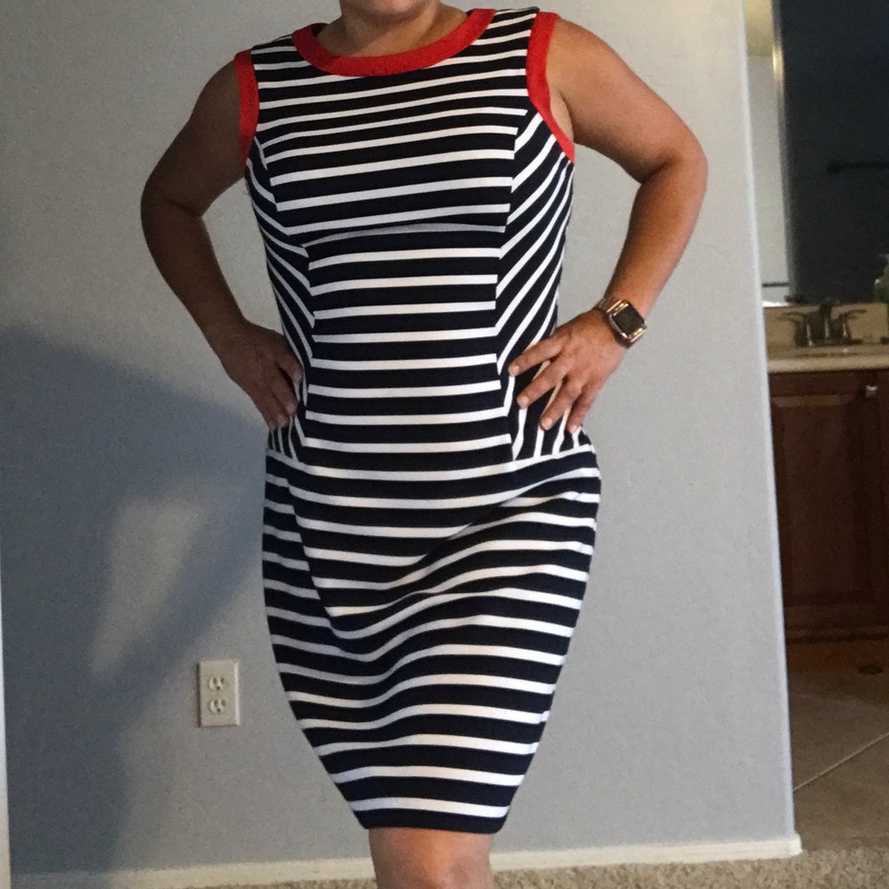 Pretty blue and white dress with red details.