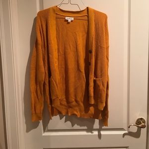 A burnt orange cardigan
