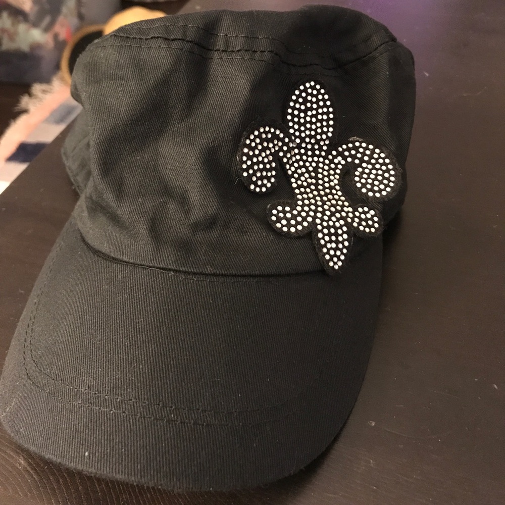 Hat with jeweled emblem