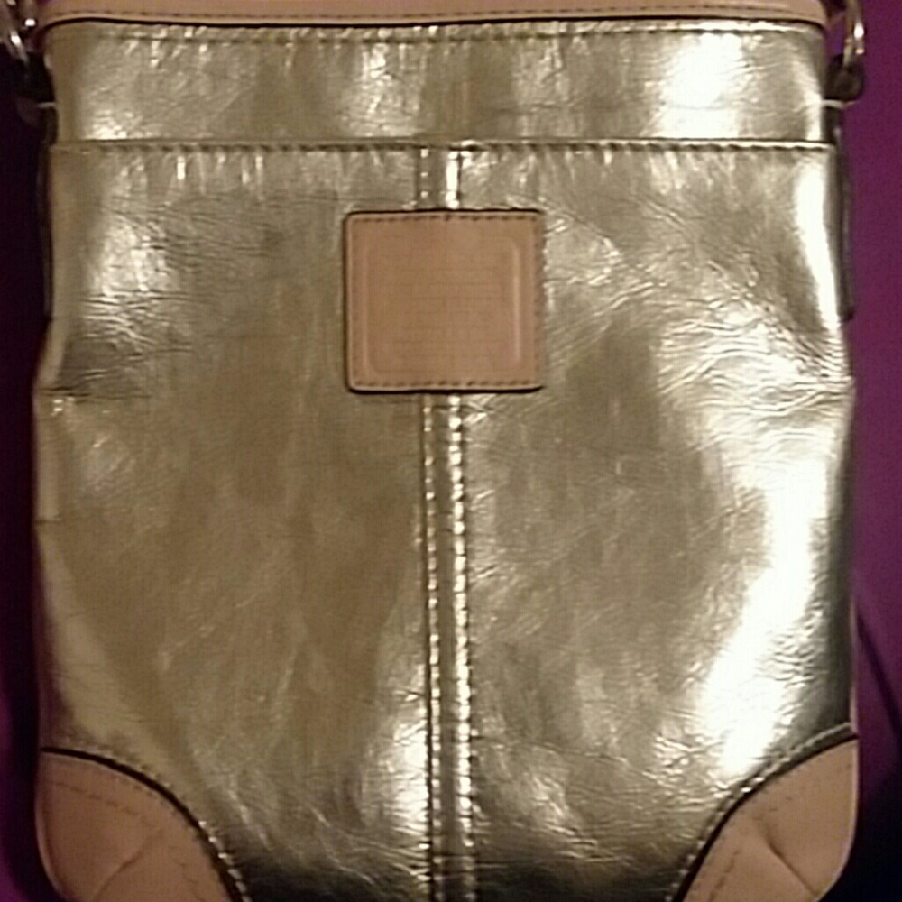 Gold COACH Swingpack purse