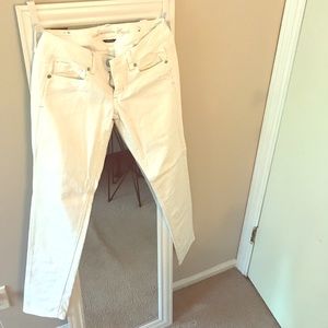 Form hugging, low-rise white denim jeans