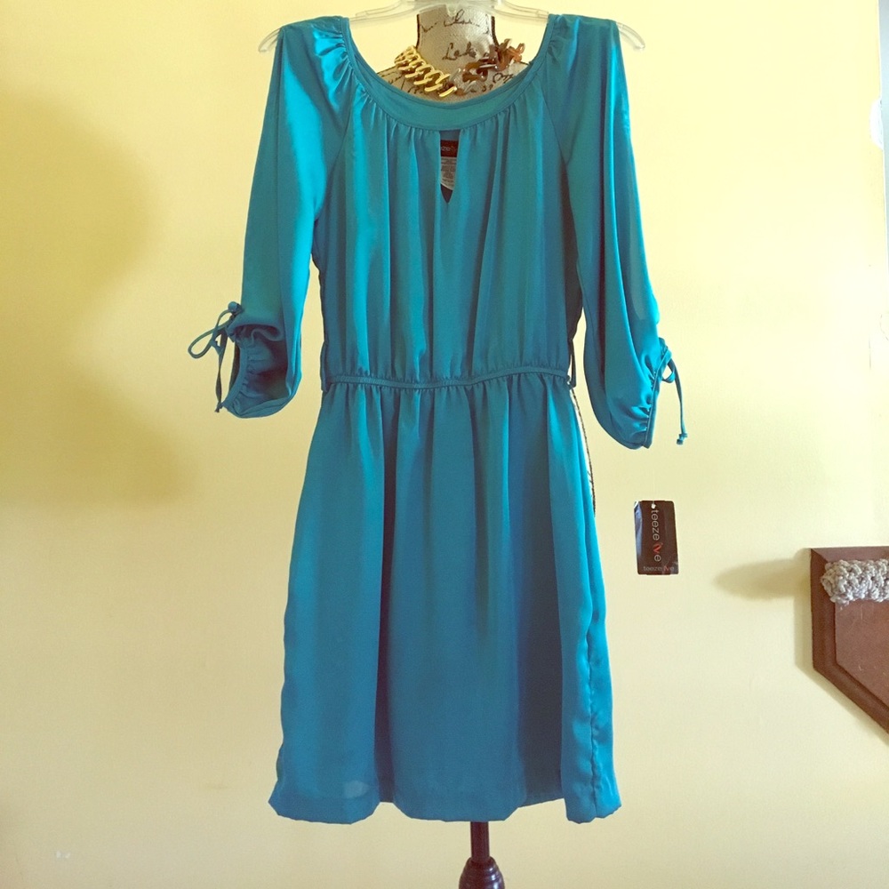Teal color dress with peek a boo sleeves