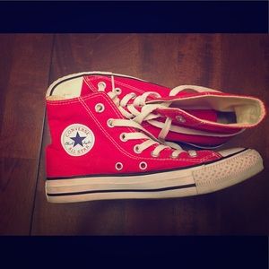 Red converse high top sneakers.