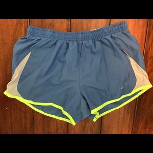 Blue Nike running shorts