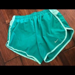 Green Nike running shorts