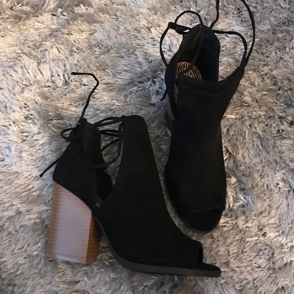 Black and brown ankle booties, open toe.