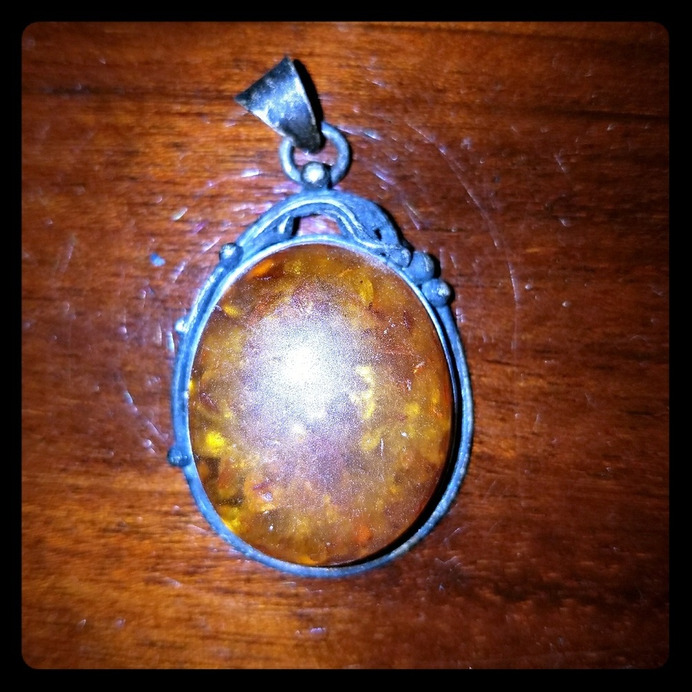 Baltic amber w inclusions set in sterling silver.