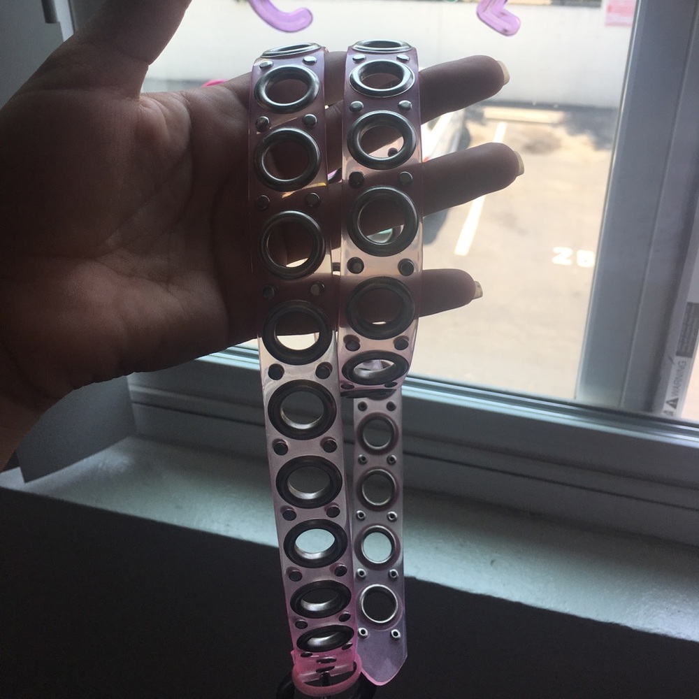 Pink belt with silver holes.