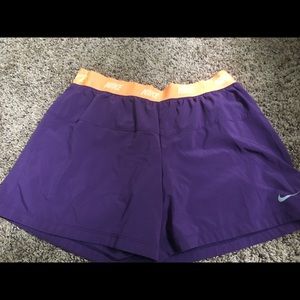 Purple and orange nike shorts with spandex