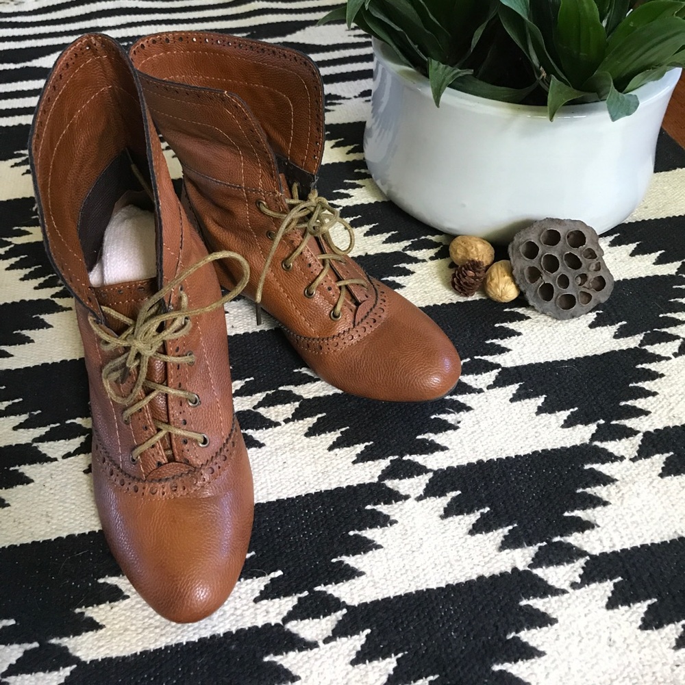 Brown lace up wing tip boots